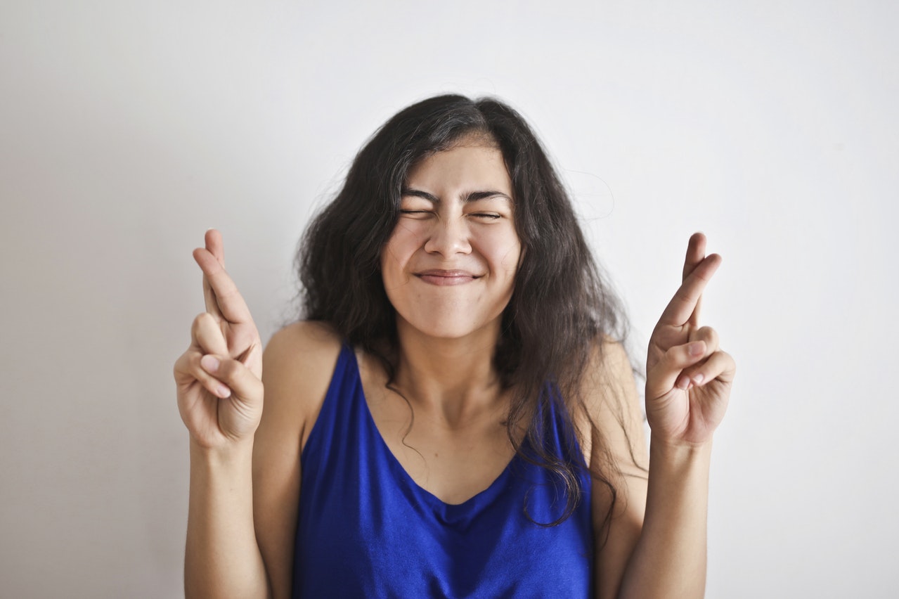 Woman in Blue Tank Top Smiling thinking 1 Love Life