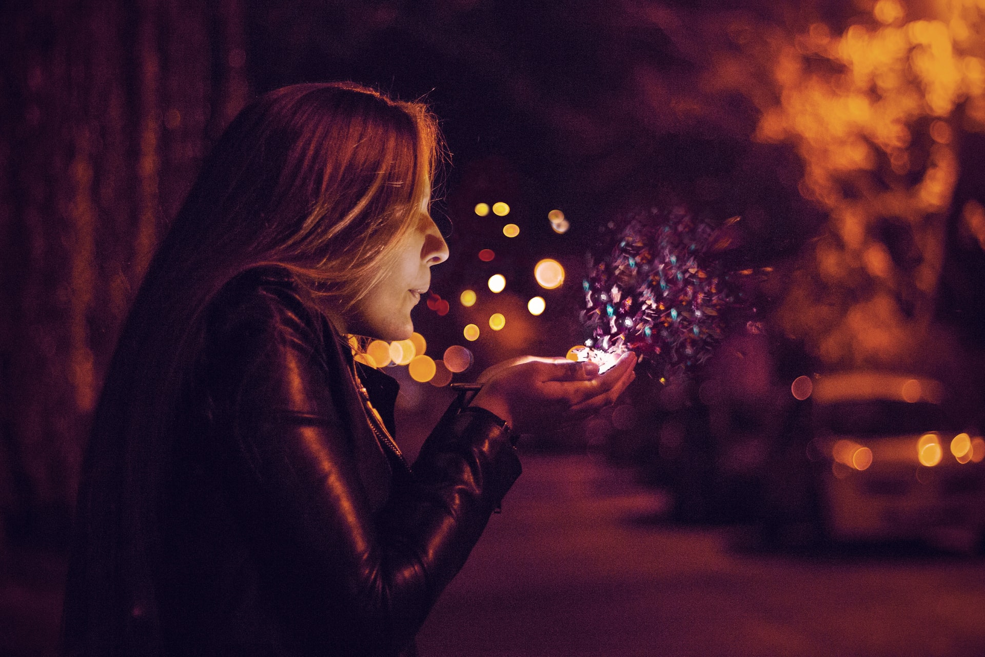 Girl blows crumbs of magic
