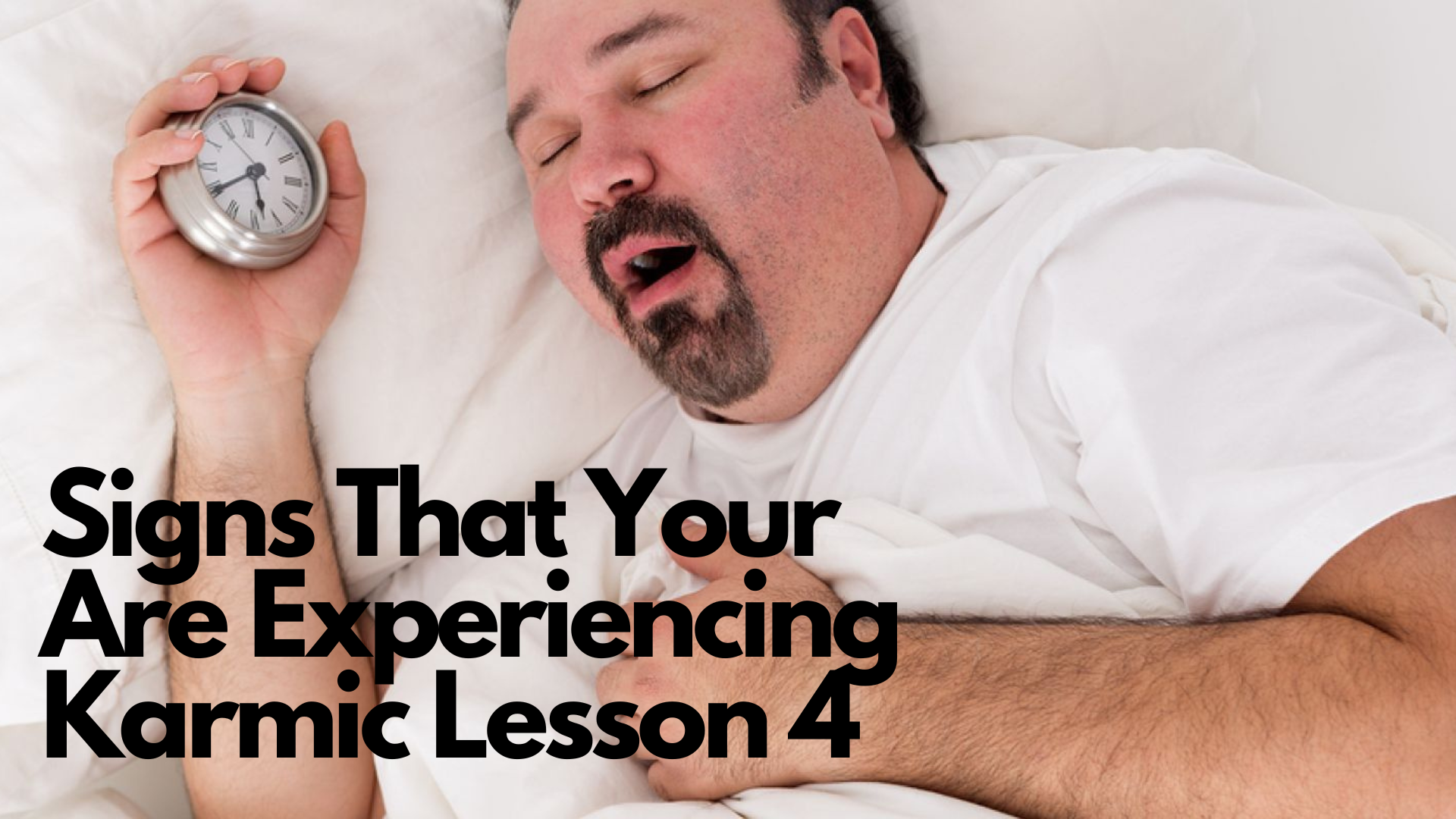 A fat man sleeping while holding a clock