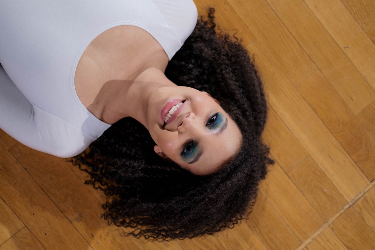 Top View of a Woman Lying Down the Floor