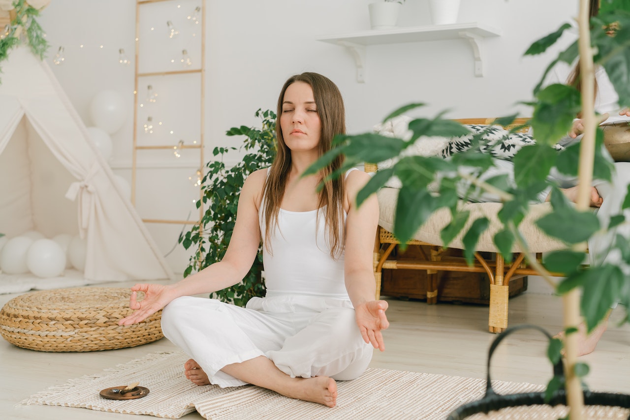 Women In White Shirt Meditating