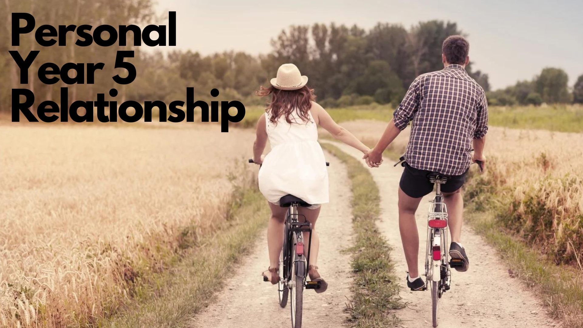 A couple riding a bike while holding each others hands