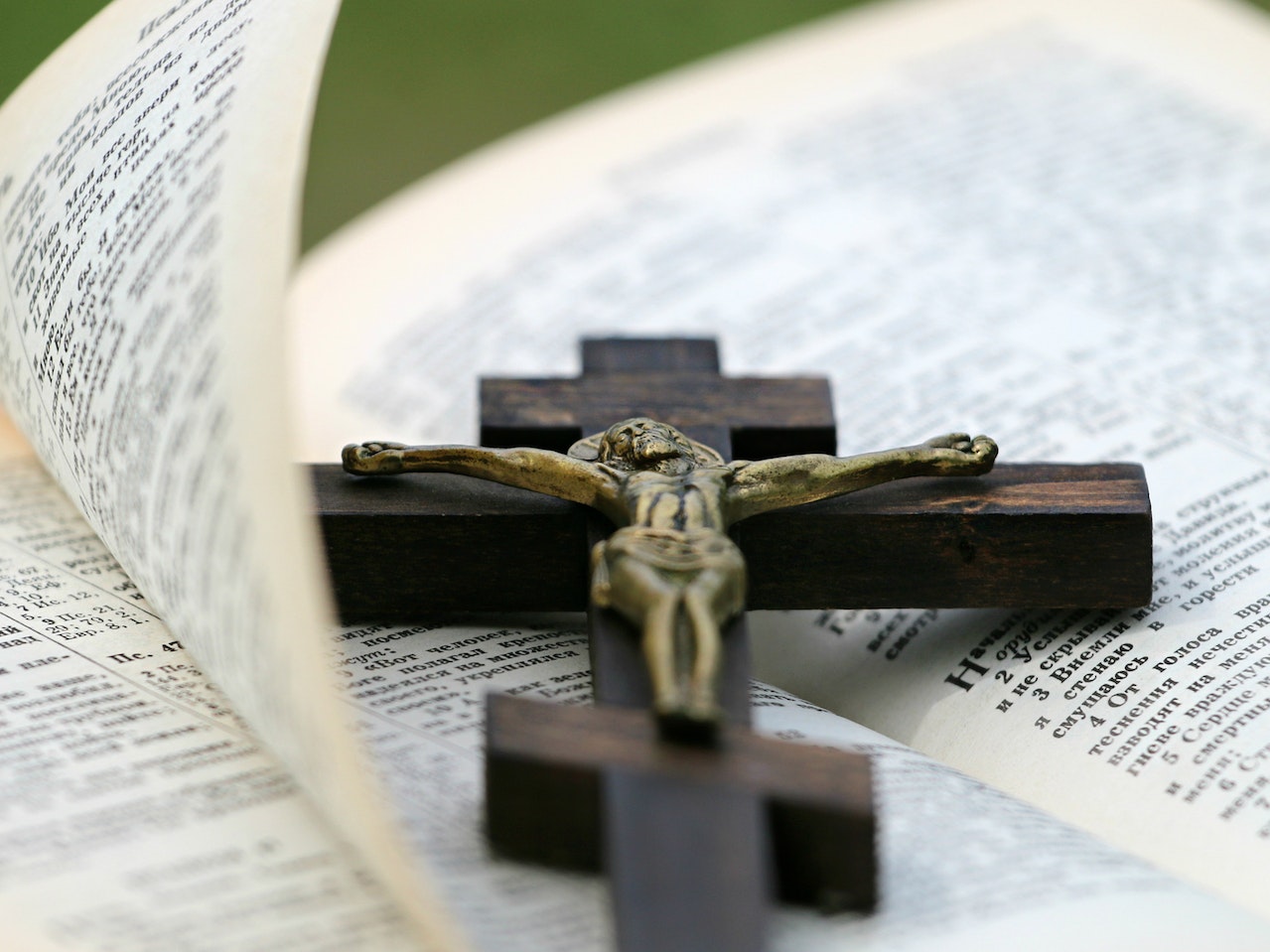Crucifix on Top of an Open Bible