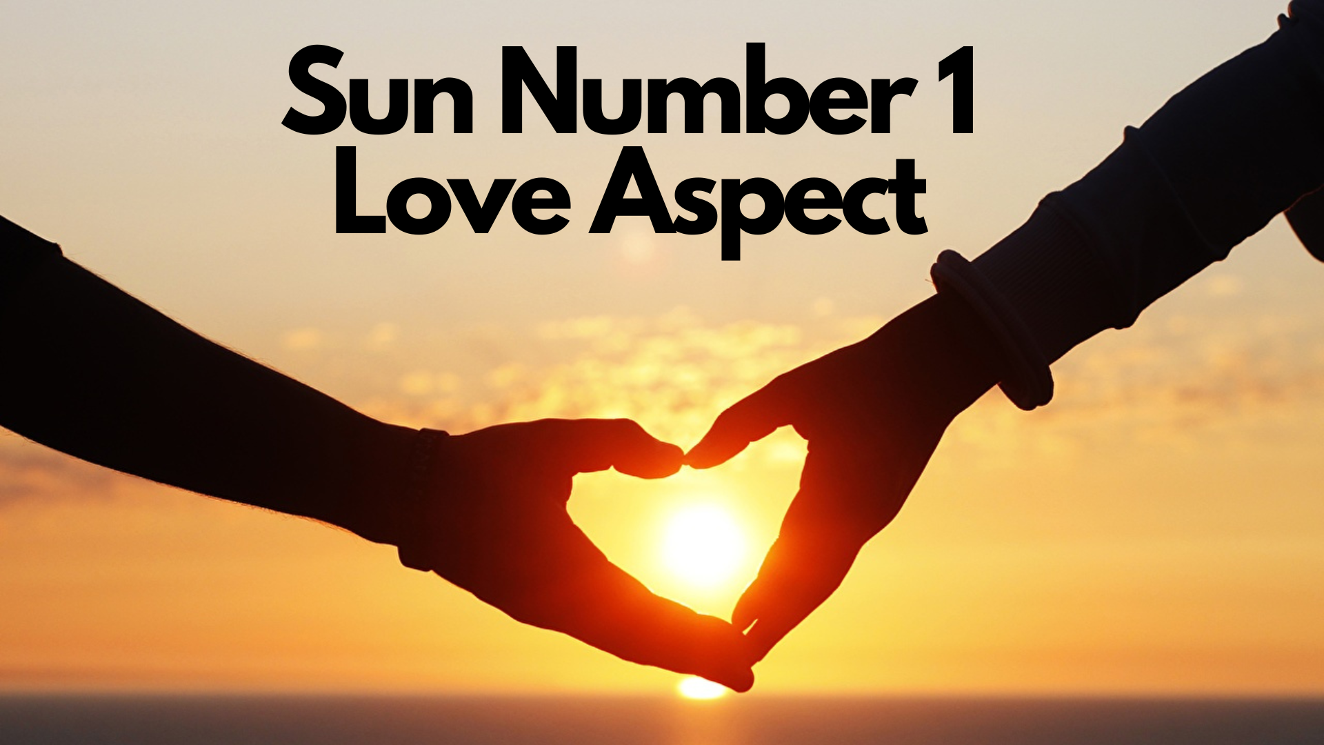 A couple with their hands in heart shaped gestures while in front of the sunset