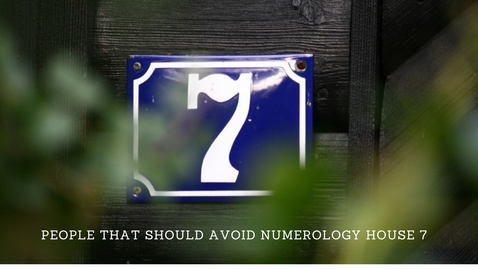 A wooden black wall with a blue plate with number 7 on it