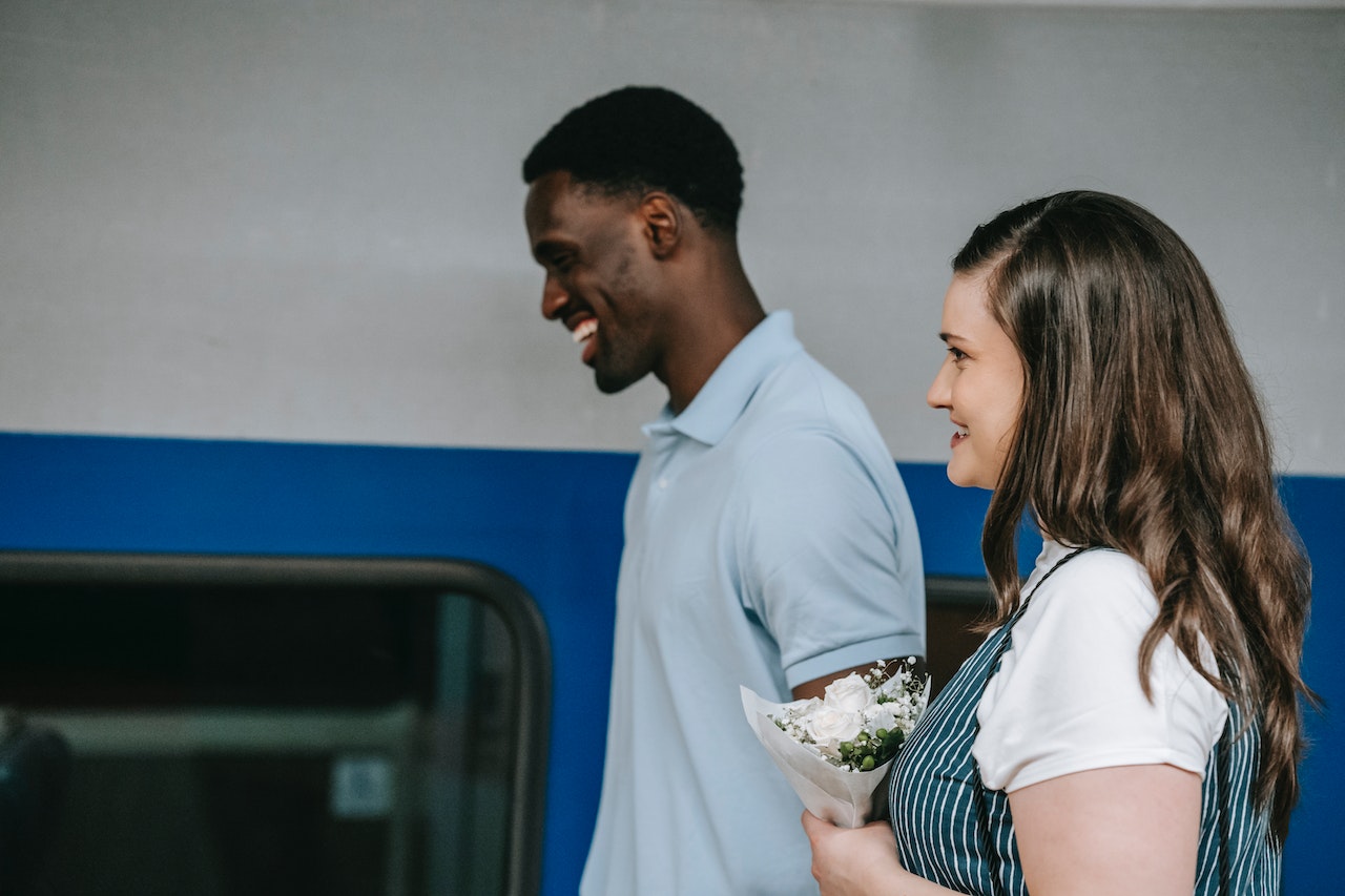 A Man Walking Beside a Woman