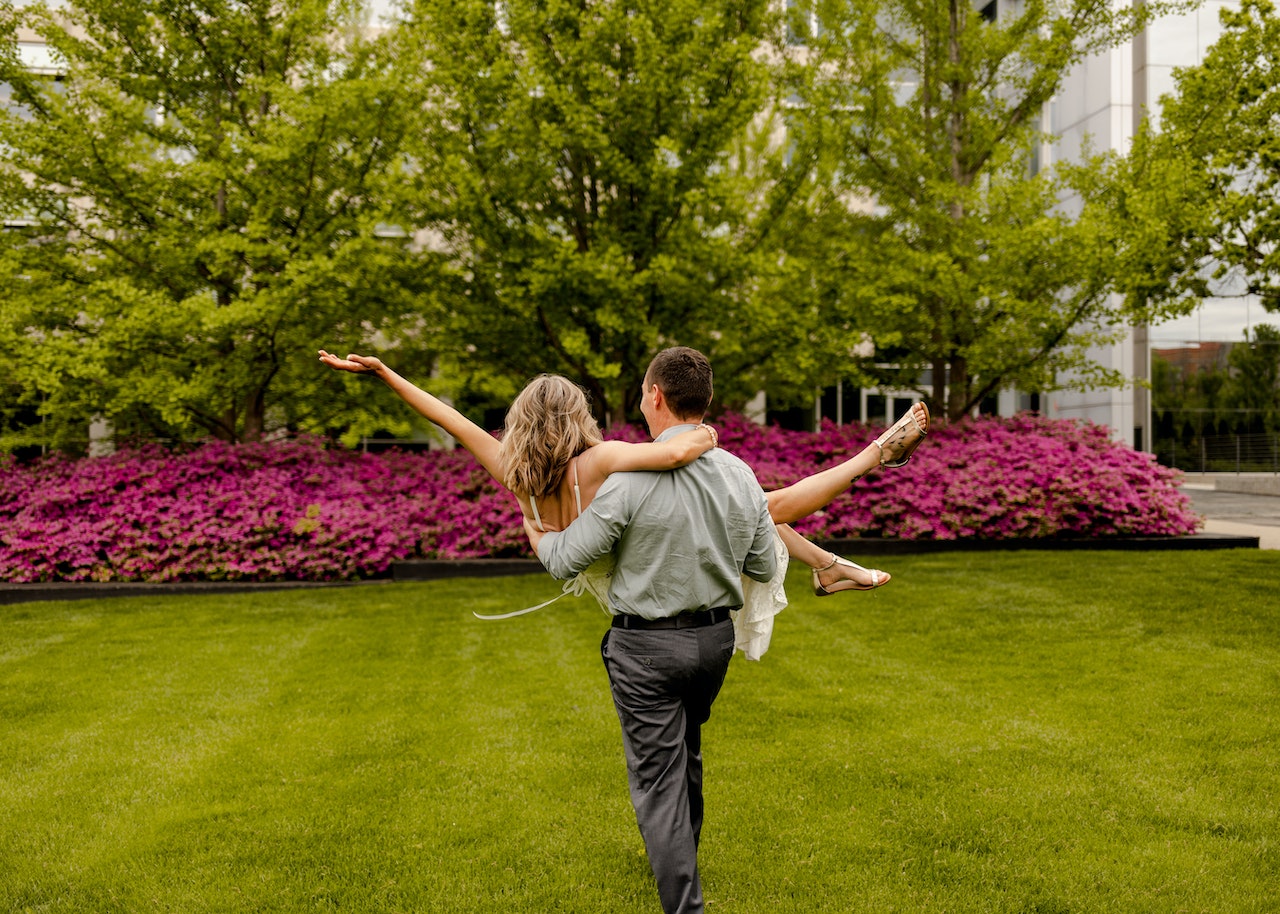 Man Carrying Woman in His Arms