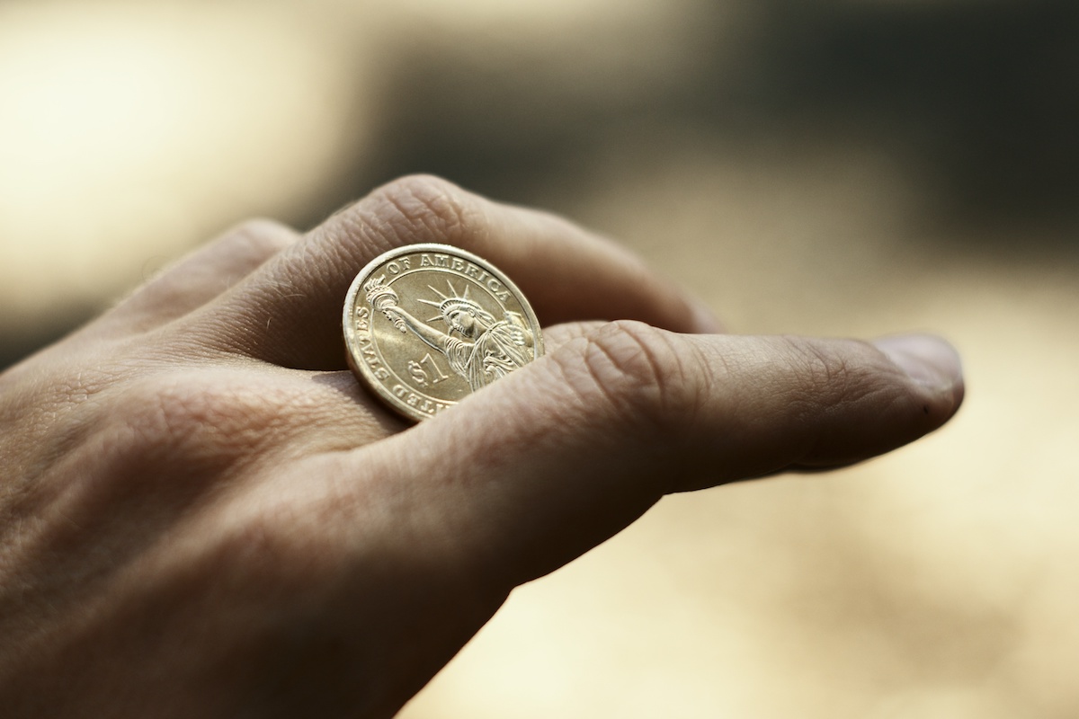 A Man Doing Coin Magic Trick