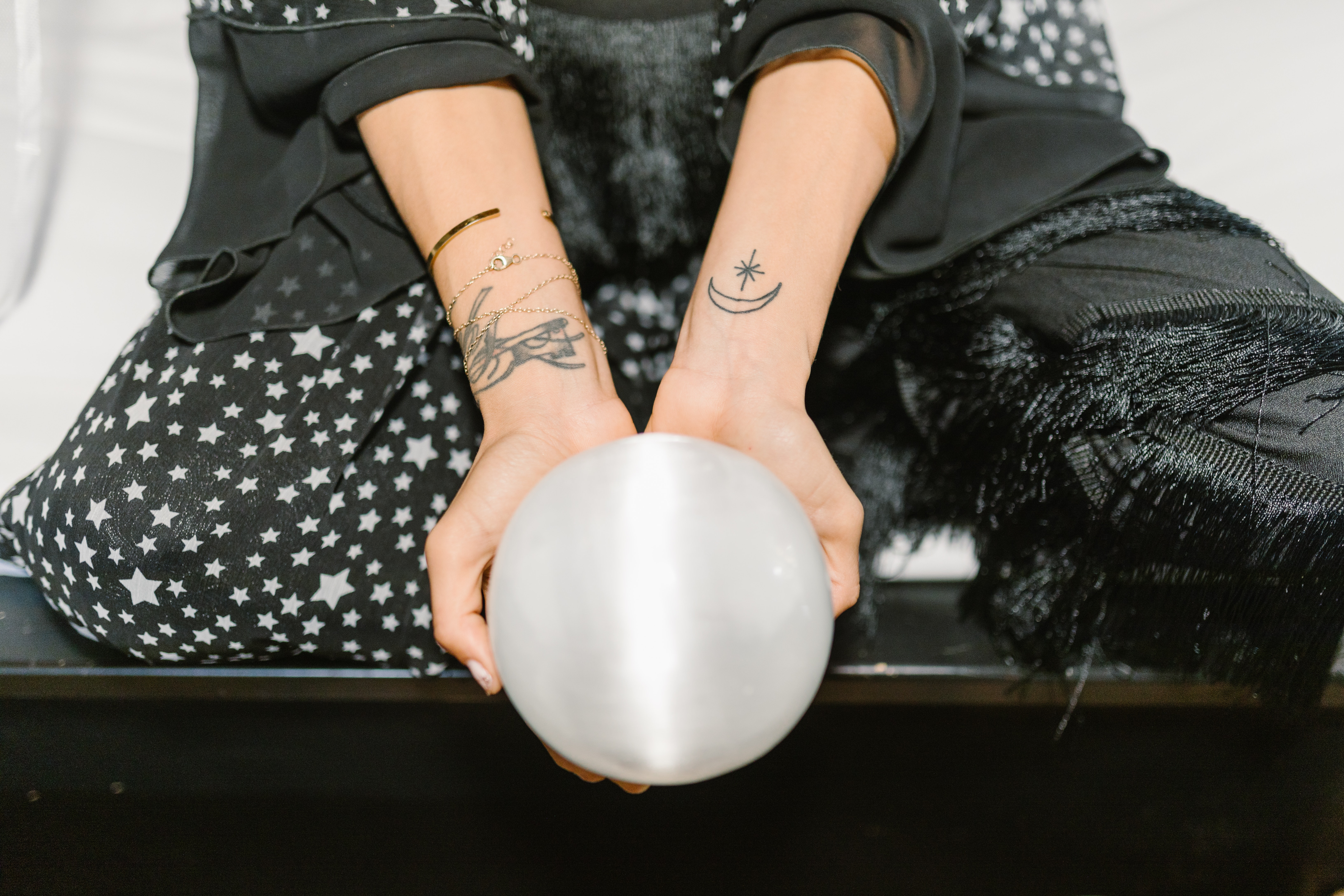 Person Holding A White Crystal