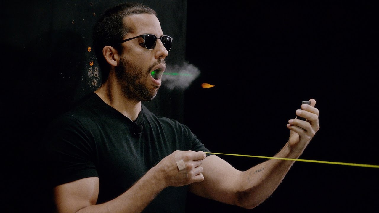 Man Catching A Bullet From Mouth