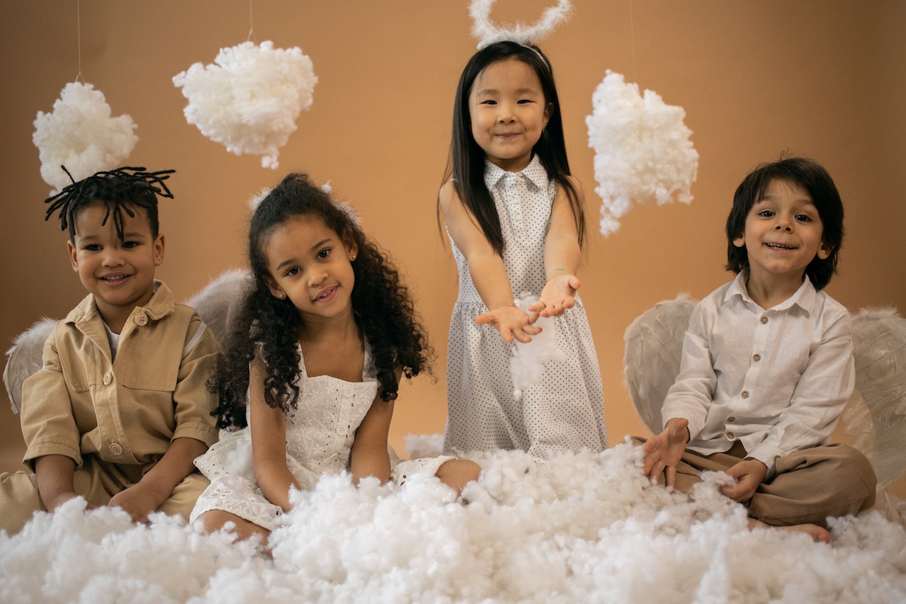 Happy kids in angel outfits