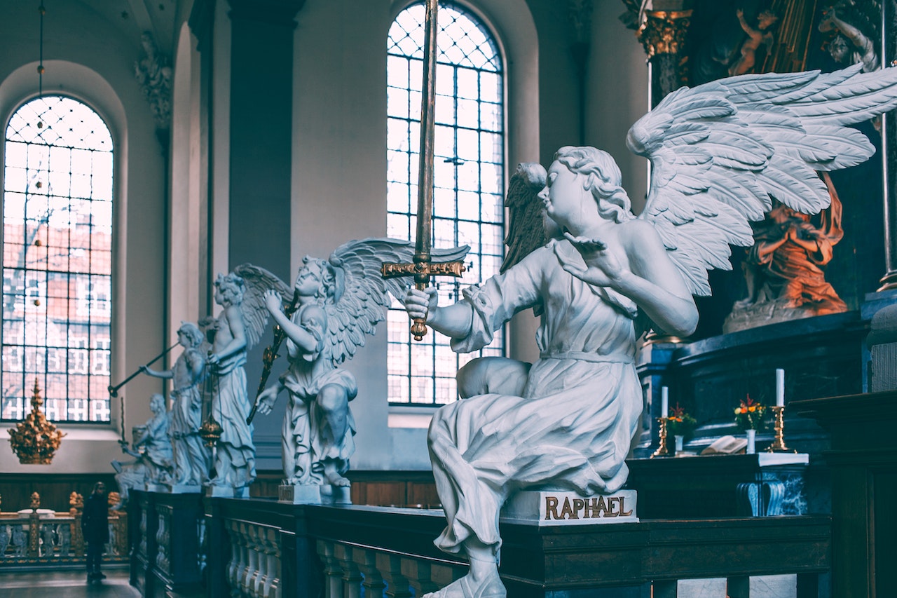Baroque Altarpiece With Sculptures Of Angels In Catholic Cathedral