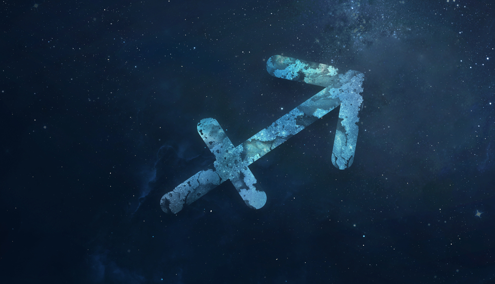 Sagittarius zodiac sign in starry sky.