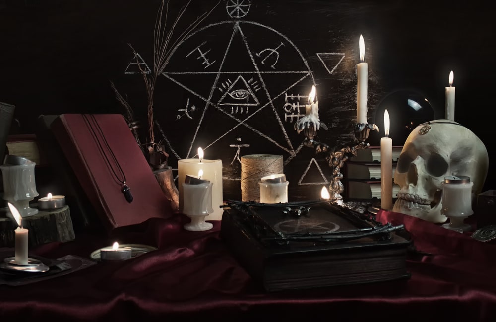 Drawing on wall, candles and skull.