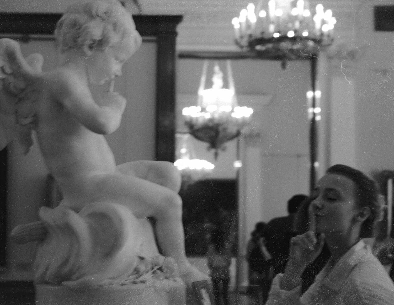 Woman Beside Statue of an Angel