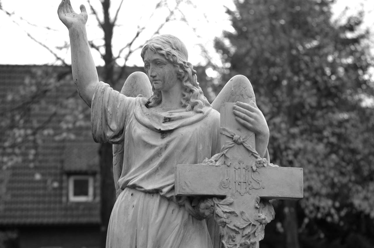 Angel Statue and a Cross