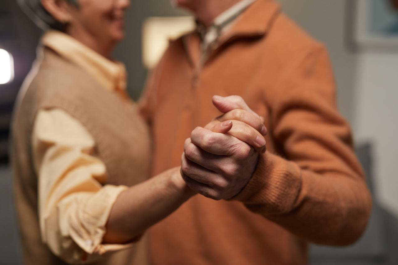 Couple Holding Each Other's Hands