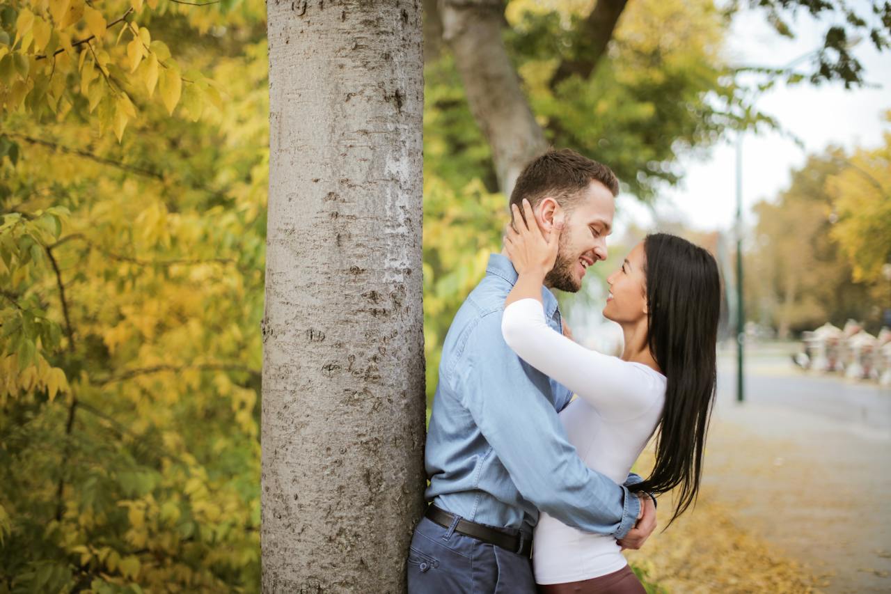 Couple Is Hugging Beside Tree